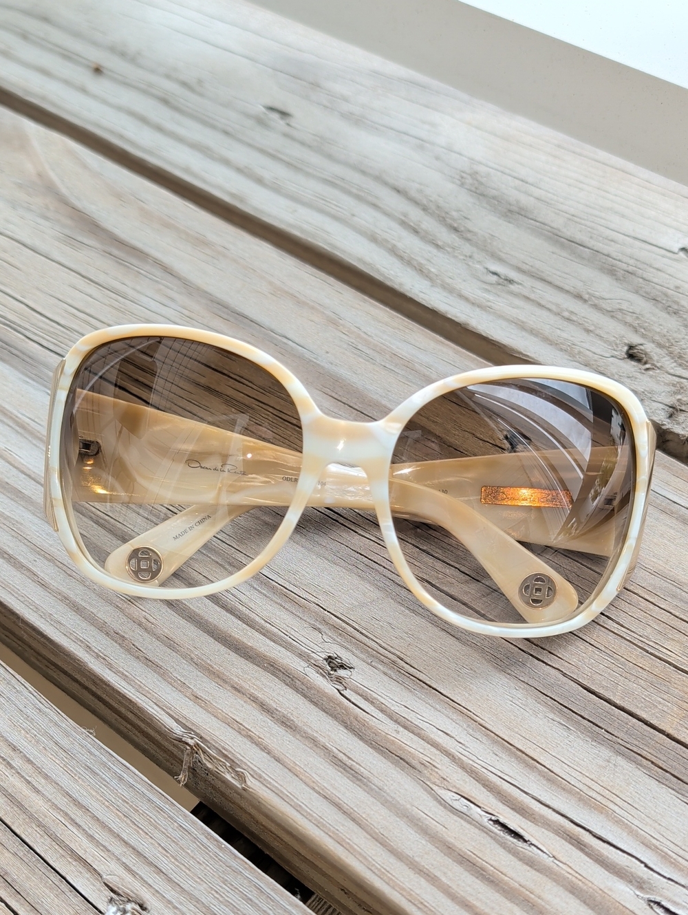 Oscar de la Renta Oversized Marbled Sunglasses.